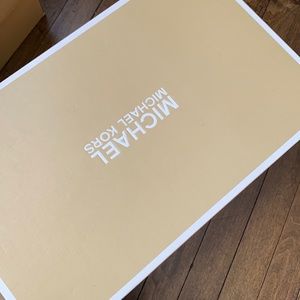 Red and white Michael Kors sneakers